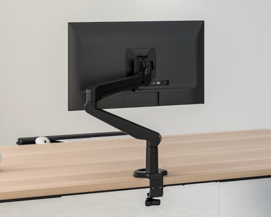 Image of a monitor arm on a desk